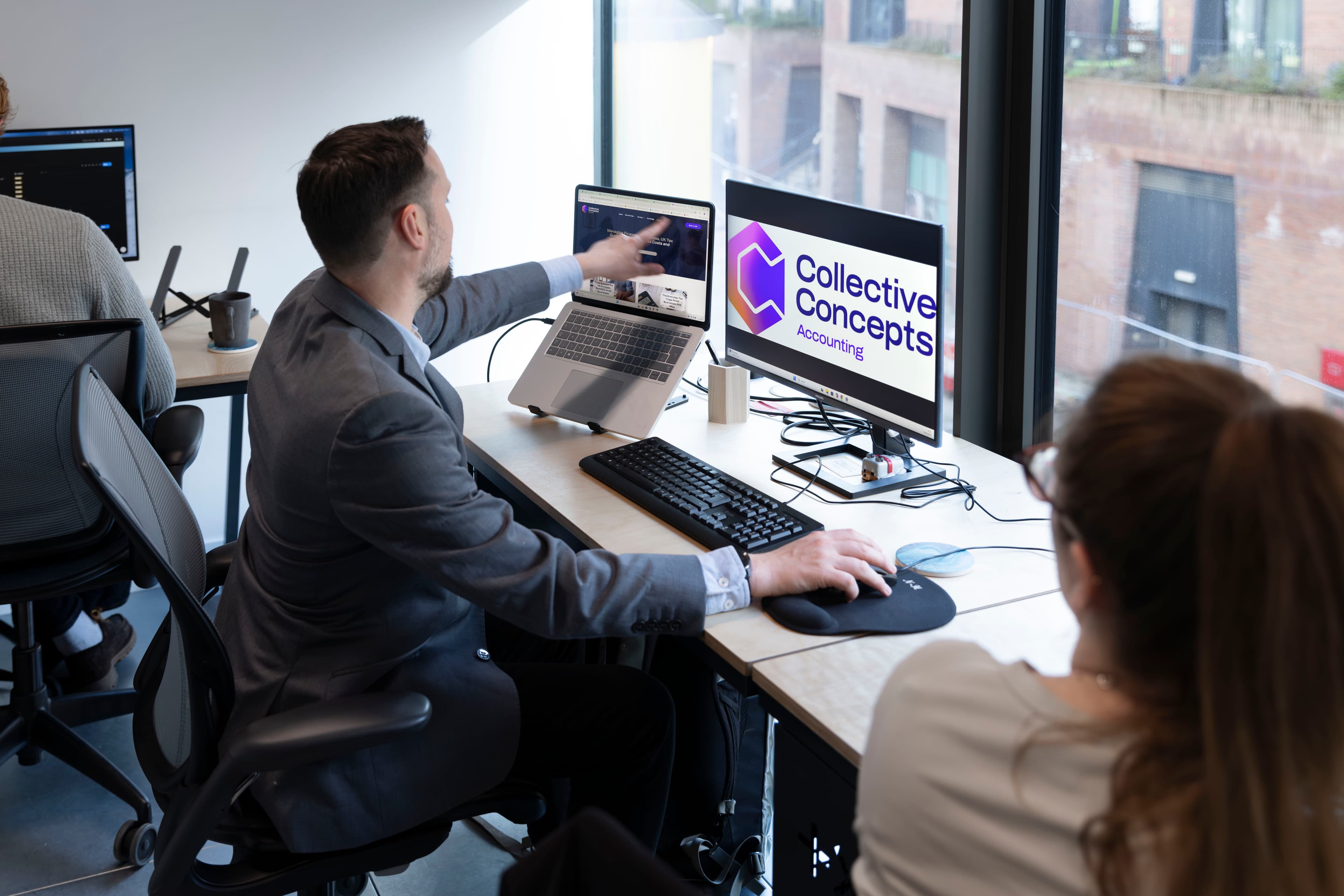 Reviewing accounts on screen at the Acenteus office